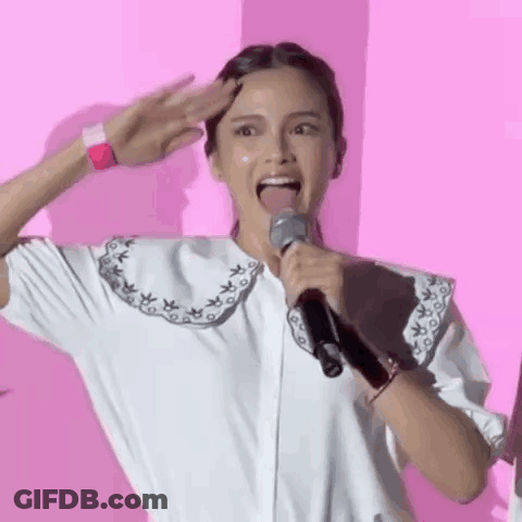 Woman Holding Microphone With Tongue Out GIF