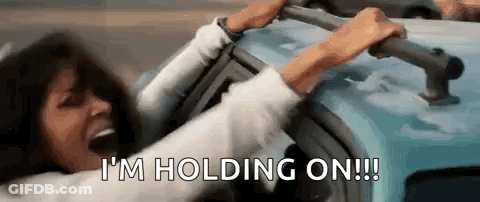 Woman Holding Onto Car Handles GIF