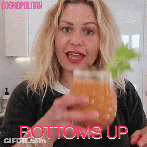 Woman Holding Orange Juice Bottoms Up GIF