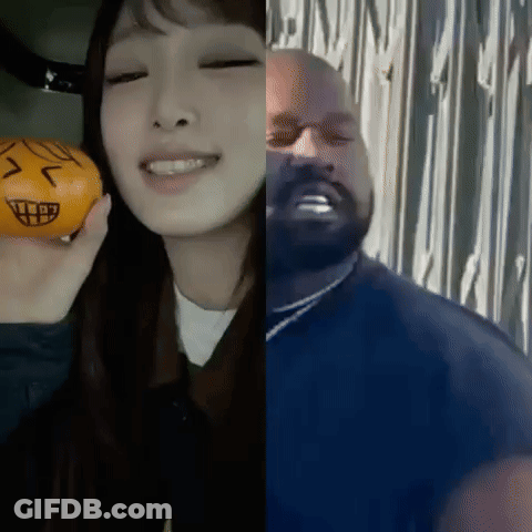 Woman Holding Orange Next To Man With Face GIF