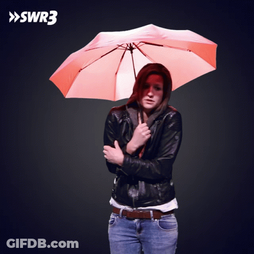 Woman Holding Orange Umbrella In Front Of SWR3 Sign GIF