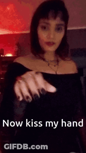Woman Holding Out Hand Saying Now Kiss My Hand GIF