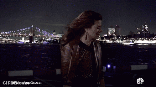 Woman Holding Paper In Front Of Bridge #WillAndGrace GIF