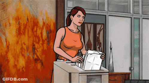 Woman Holding Paper In Front Of Fire Wall GIF