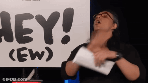 Woman Holding Paper In Front Of Sign Saying Hey (Ew) GIF