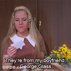 Woman Holding Paper Saying George Glass GIF