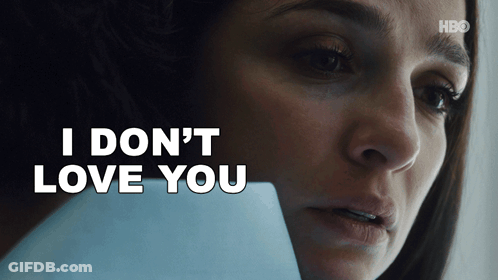 Woman Holding Paper Saying I Don't Love You GIF