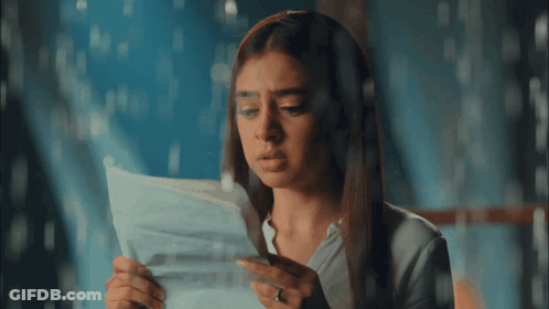 Woman Holding Paper Saying I Love You GIF