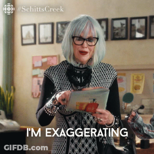 Woman Holding Paper Saying I'm Exaggerating GIF