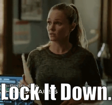 Woman Holding Paper Saying Lock It Down GIF