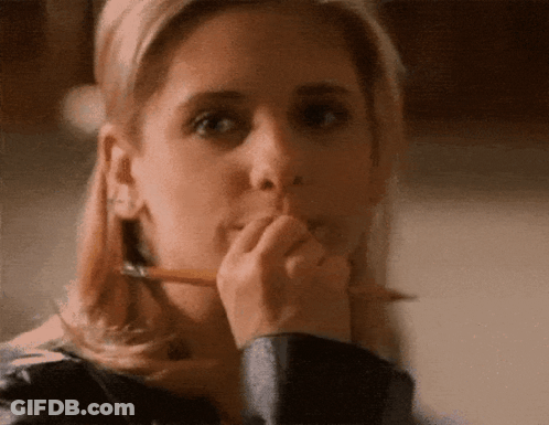 Woman Holding Pencil To Mouth GIF