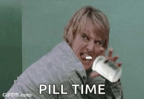 Woman Holding Pills Screaming GIF
