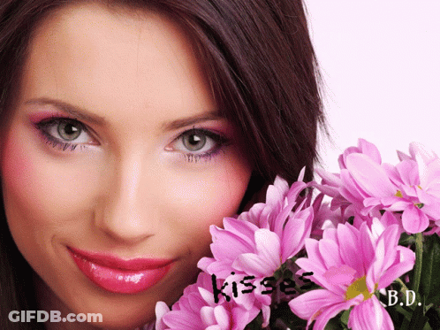 Woman Holding Pink Flowers With Kisses GIF