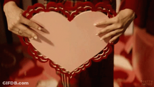 Woman Holding Pink Heart With Pretty Shows GIF
