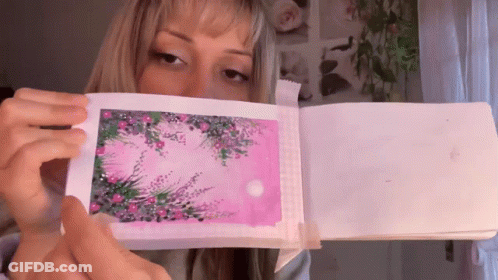 Woman Holding Pink Paper GIF