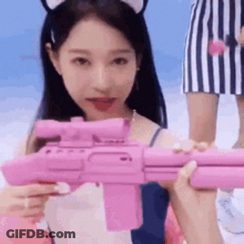 Woman Holding Pink Toy Gun GIF
