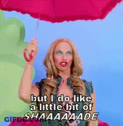 Woman Holding Pink Umbrella Saying But I Do Like A Little Bit Of Shaaaaade GIF