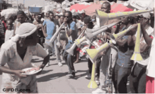 Woman Holding Plate Of Food With Trumpet Players GIF