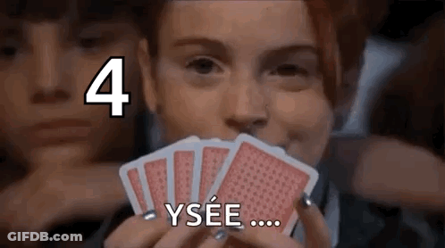 Woman Holding Playing Cards Saying Ysee GIF