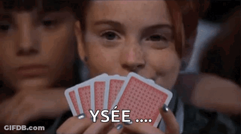 Woman Holding Playing Cards Saying Ysee GIF