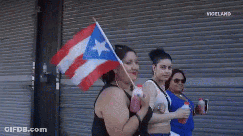 Woman Holding Puerto Rico Flag GIF