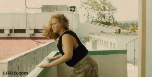 Woman Holding Railing On Balcony Hair Blowing GIF