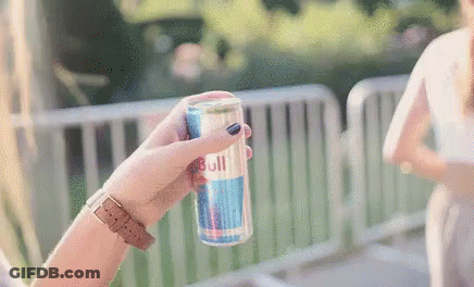 Woman Holding Red Bull Can GIF