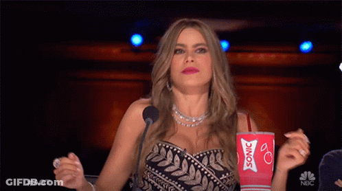 Woman Holding Red Cup Saying Sonic GIF