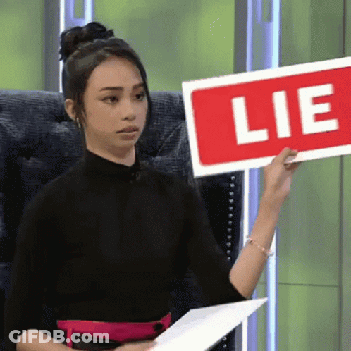 Woman Holding Red Lie Sign GIF