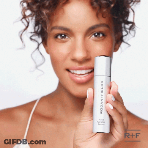 Woman Holding Rodan Fields Hydration Serum GIF