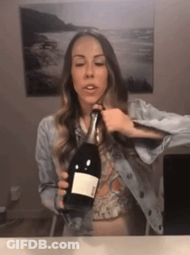 Woman Holding Ross Wine Bottle GIF