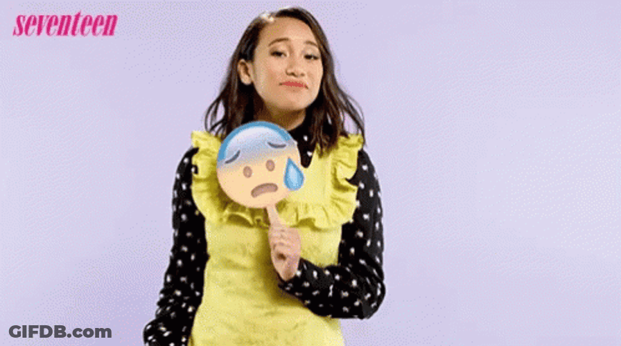 Woman Holding Sad Emoji Sensible Chuckle GIF
