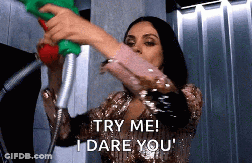 Woman Holding Shower Head Saying Try Me I Dare You GIF