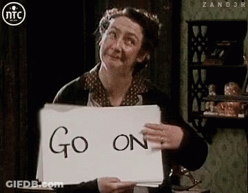 Woman Holding Sign Saying Go On GIF