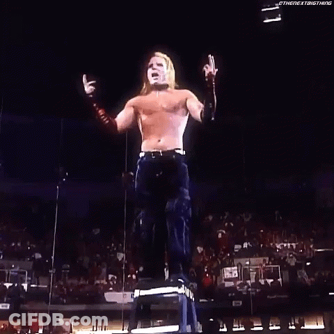 Woman Holding Sign Saying Wes On Stage GIF
