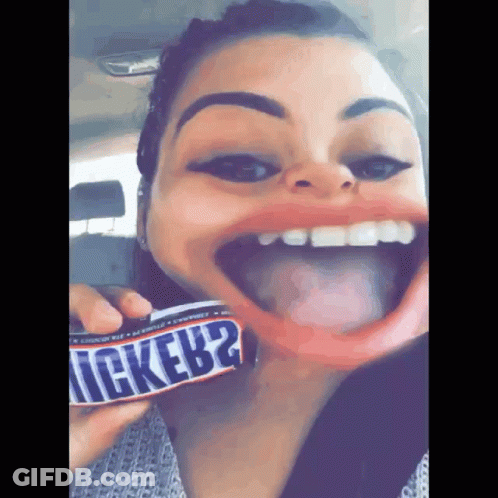 Woman Holding Snickers Bar GIF
