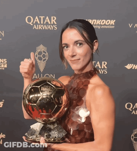 Woman Holding Soccer Ball In Front Of Qatar Airways Sign GIF