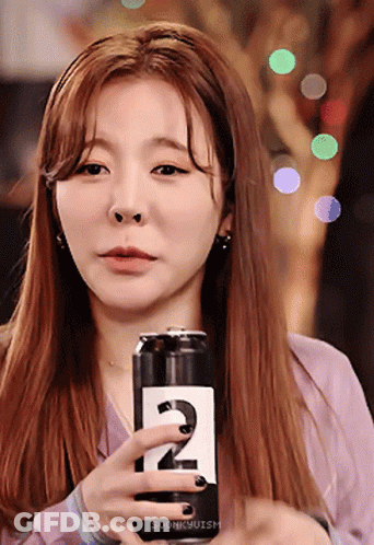 Woman Holding Soda Can With Number 2 GIF