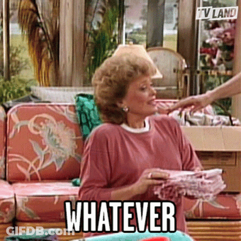 Woman Holding Stack Of Clothes Saying Whatever GIF