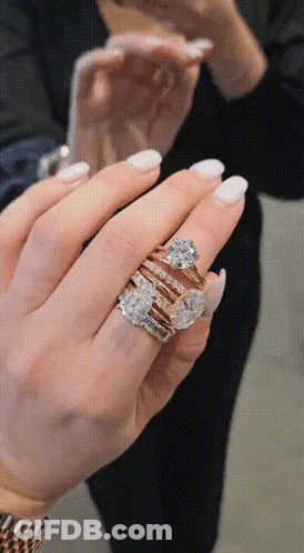 Woman Holding Stack Of Rings GIF
