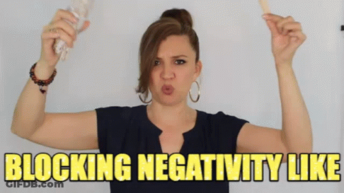 Woman Holding Stick Making Face Blocking Negativity GIF