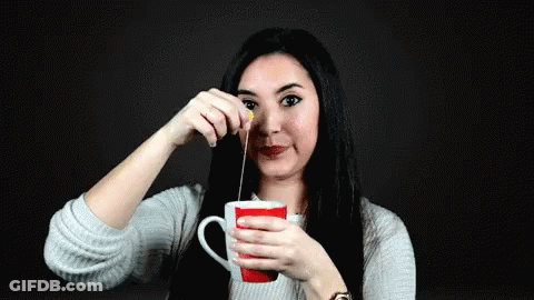 Woman Holding Tea Cup Pouring GIF