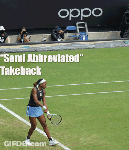 Woman Holding Tennis Racquet With Semi Abbreviated Takeback GIF