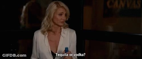 Woman Holding Tequila And Vodka GIF