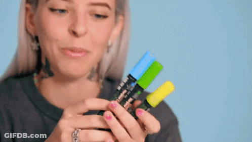 Woman Holding Three Different Colored Markers GIF