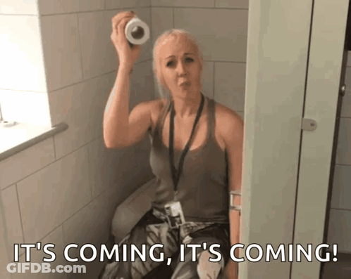 Woman Holding Toilet Paper Roll It's Coming GIF