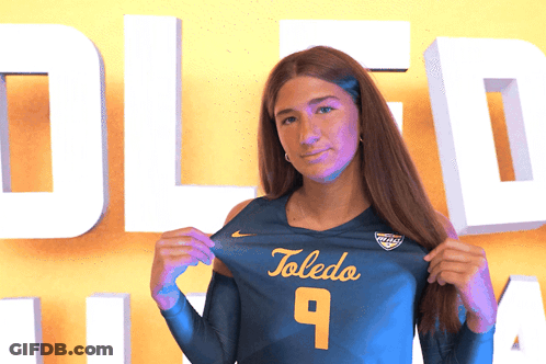 Woman Holding Toledo Jersey Number 9 GIF