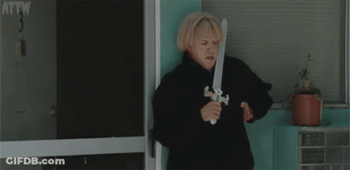 Woman Holding Toy Sword In Front Of Door Number 3 GIF