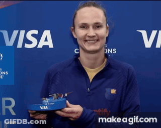 Woman Holding Trophy In Front Of Visa Banner GIF