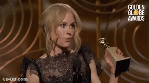 Woman Holding Trophy Talking Into Microphone Golden Globes Awards GIF